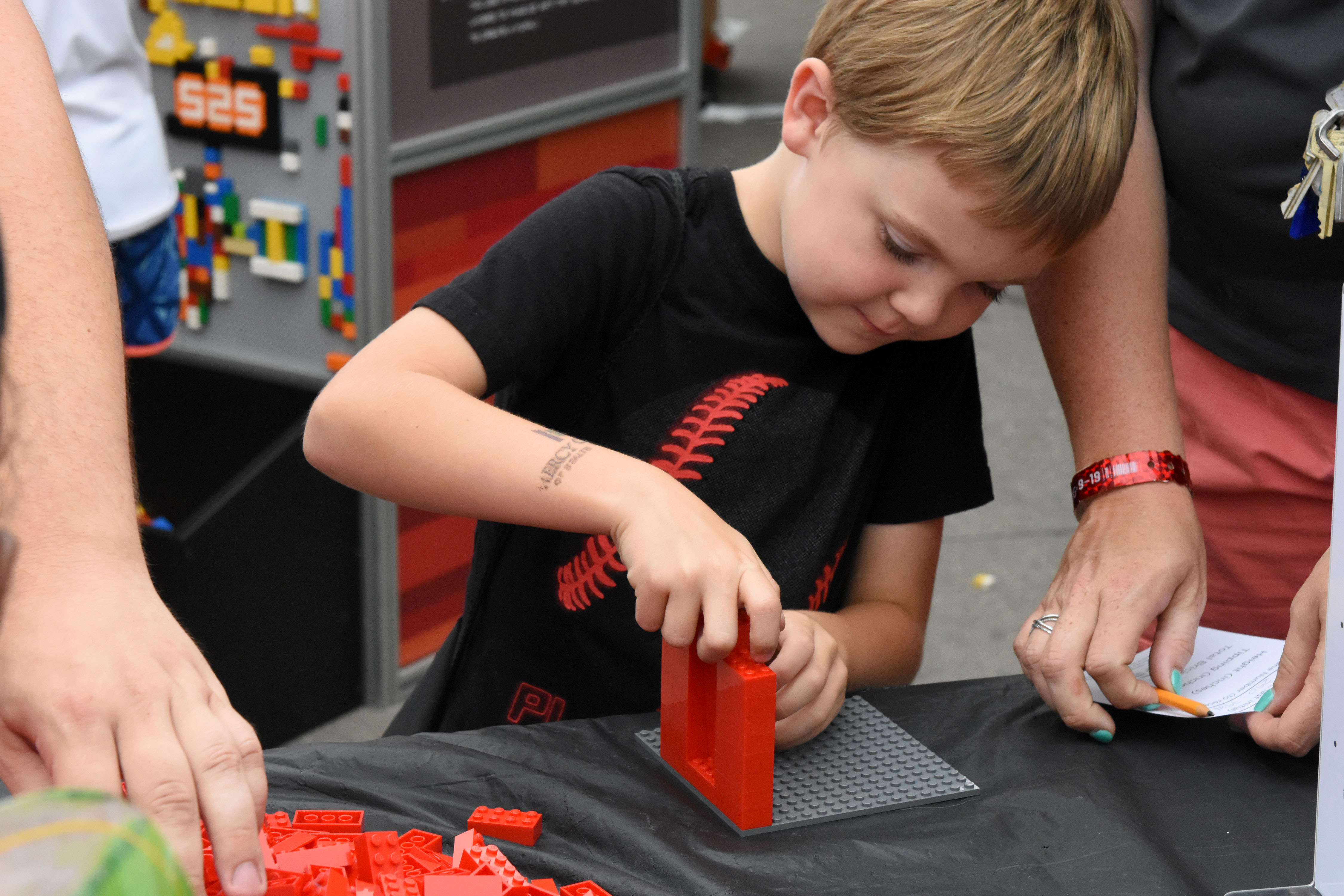 Child interacts with STEM Day at the Fair exhibit