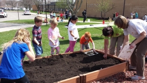 Hiawatha Elementary students plant raised beds as a part the "Agriculture in the Classroom" program